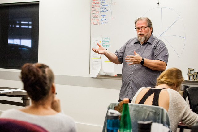 Mark Gordon facilitating a leadership session with people in the room